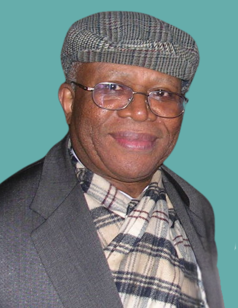 Photo of a man wearing a beret and eyeglasses