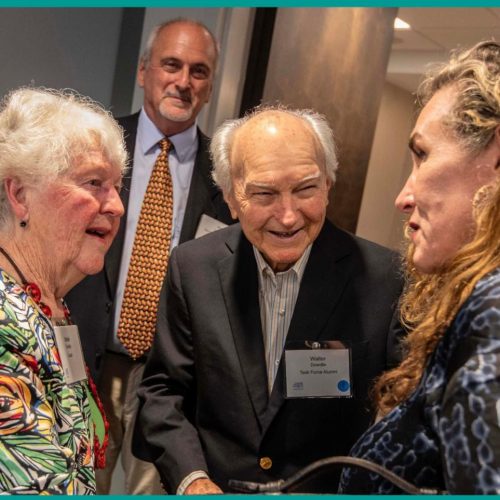 three people chat at a party